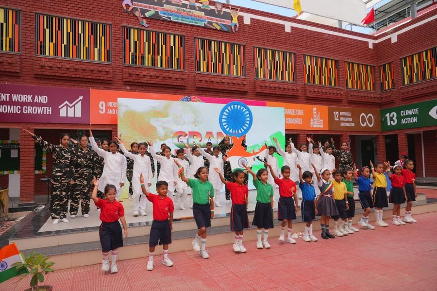 Students performing on stage for Independence Day celebrations