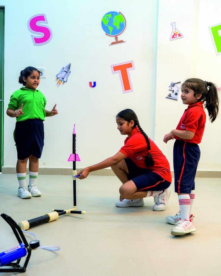 Students launching a model rocket during a STEM activity