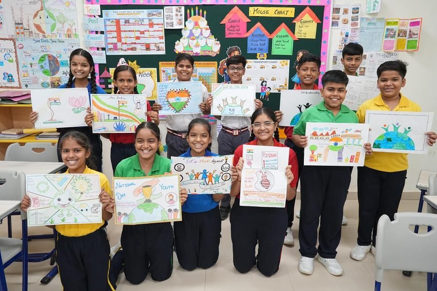 Students holding up their artwork for National Youth Day